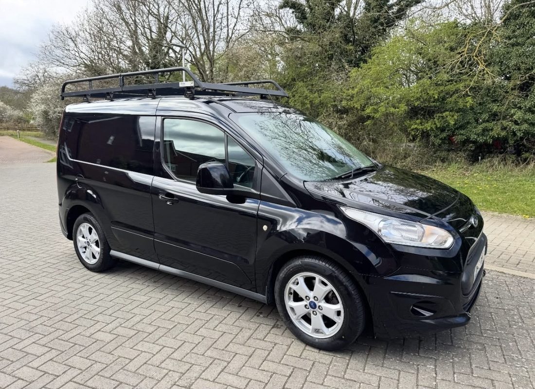 Just Moving It's small black Ford Transit Connect van in Luton